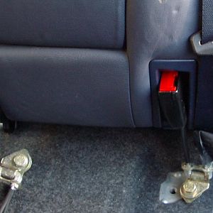 Rear seat removing bottom seat belt mounts