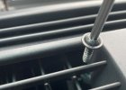 Climate button grille screws.JPG