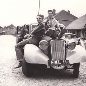 My first car. A 1947 Austin 12, pictured here around 1962 with some of my mates